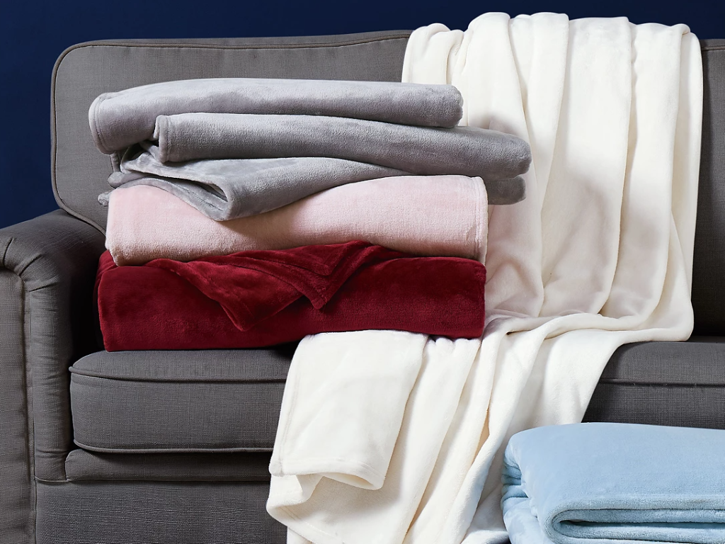 throw blankets folded on a couch