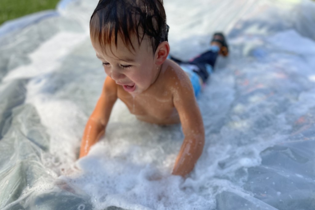 baby on DIY slip and slide