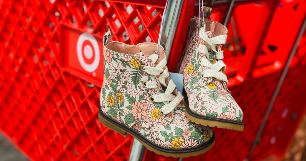 kids floral combat boots hanging on Target cart