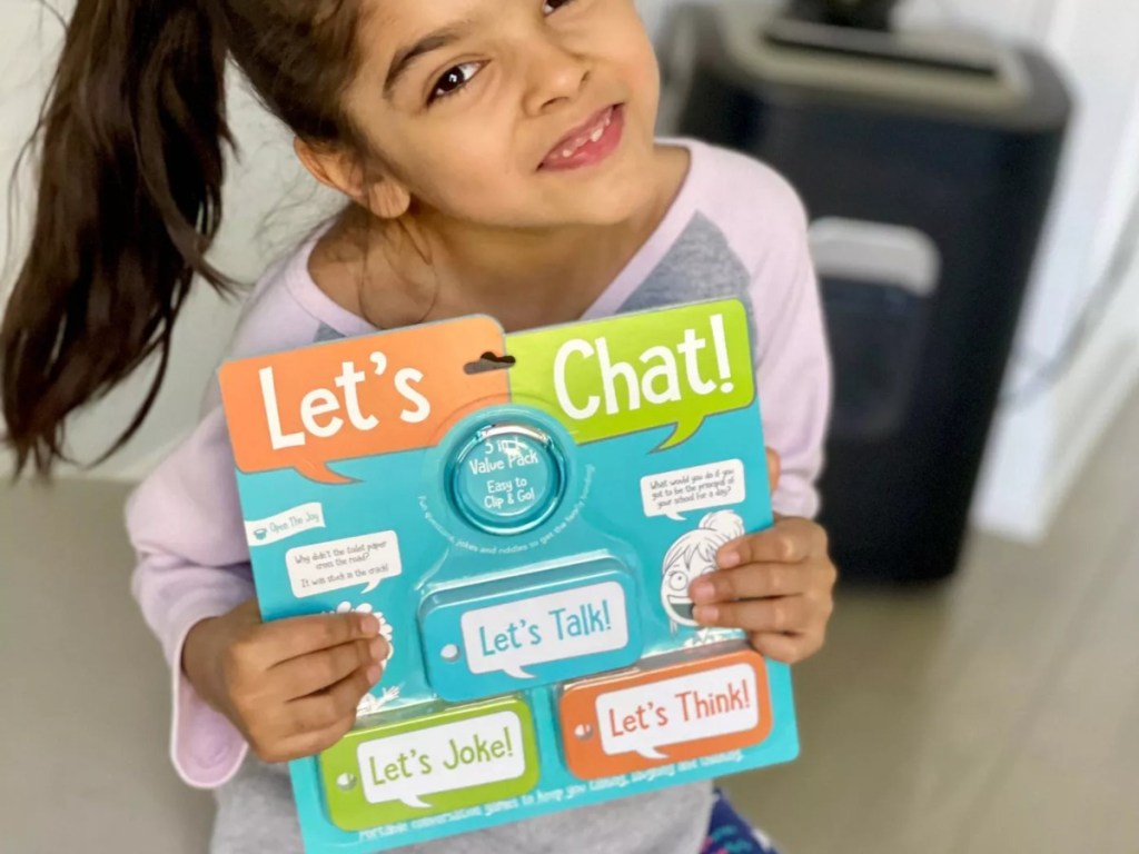 girl holding Open the Joy card set