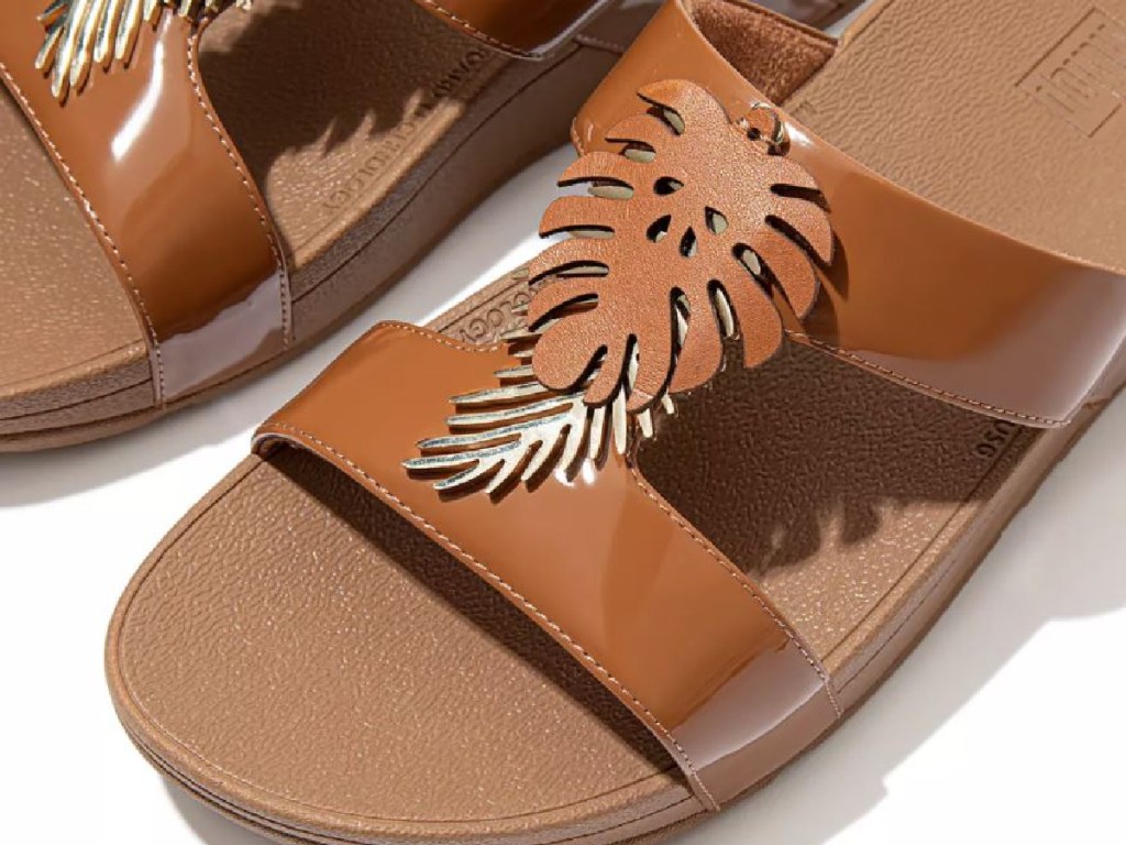 brown sandals with leaf detail