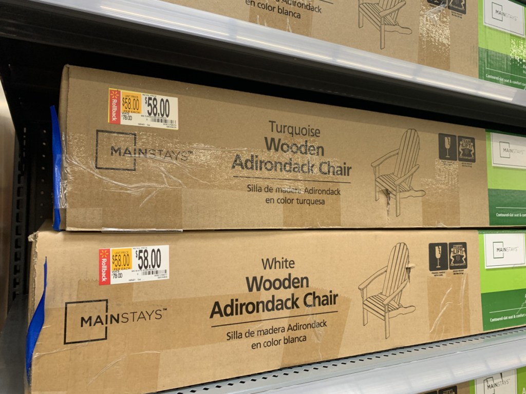 boxes with wooden chairs on store shelf