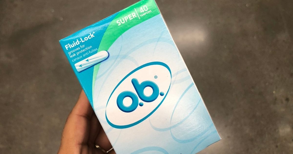 hand holding o.b. tampons box