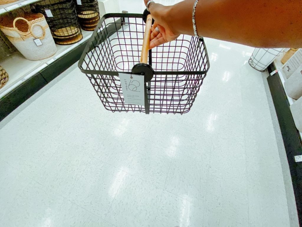 woman holding metal basket