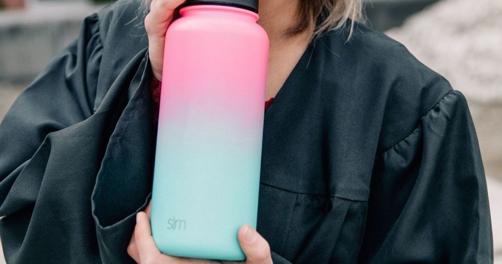 woman holding water bottle