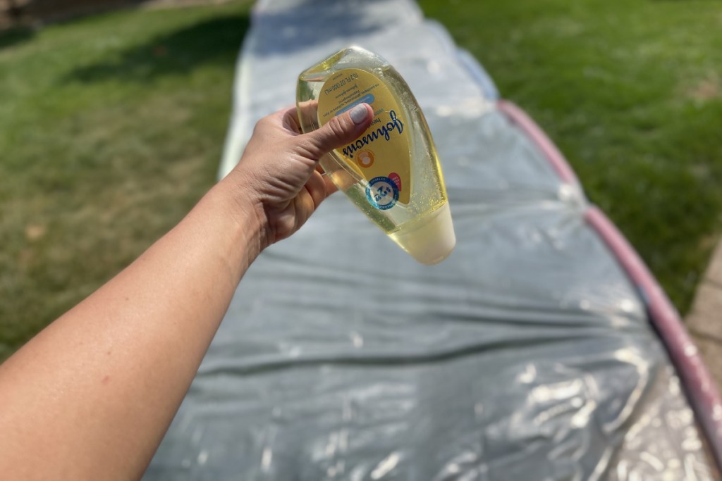 adding soap on slip and slide