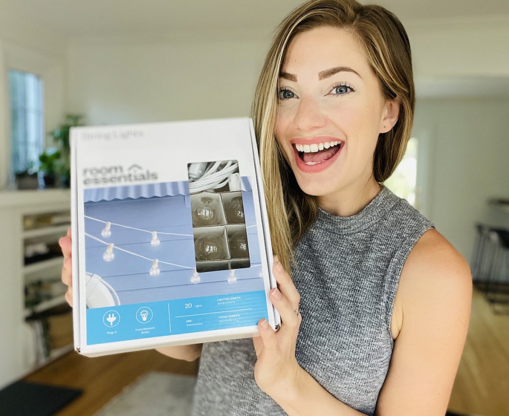 woman holding a box of string lights