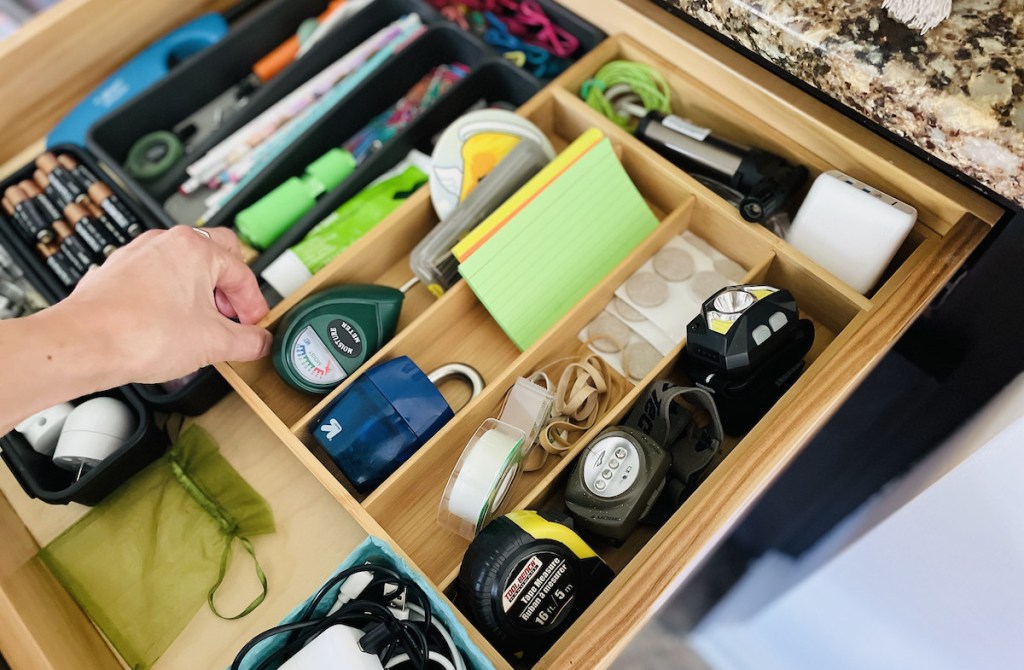 hand holding drawer organizer