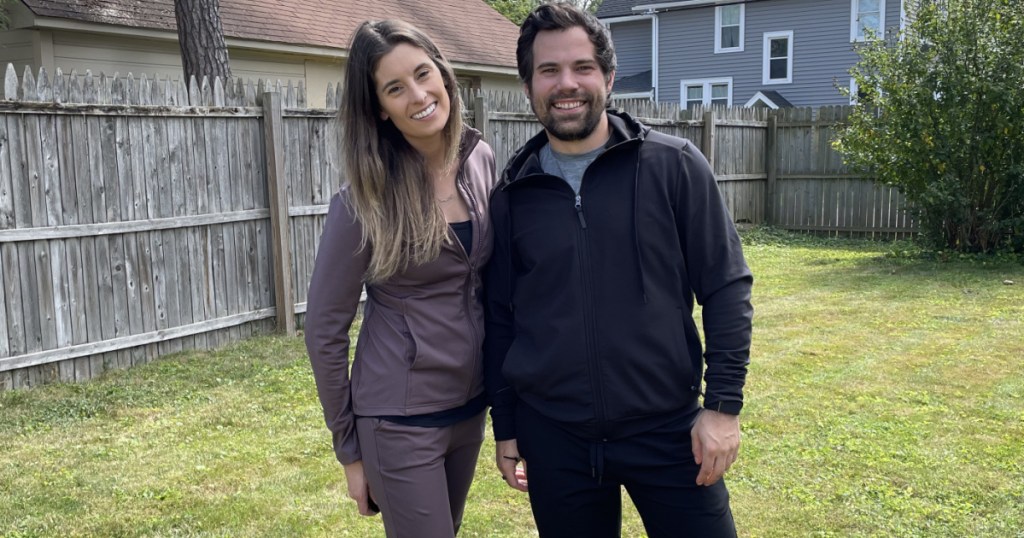 man and women wearing 32 degrees tech fleece jogger sets