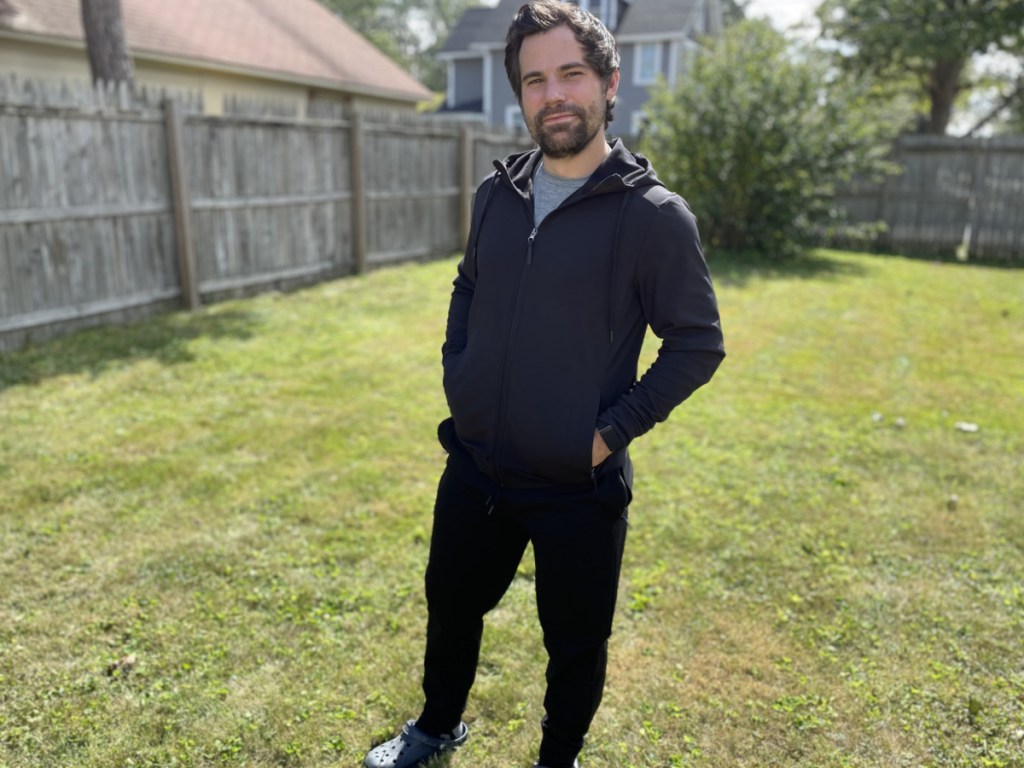 man wearing a black tech fleece jogger set