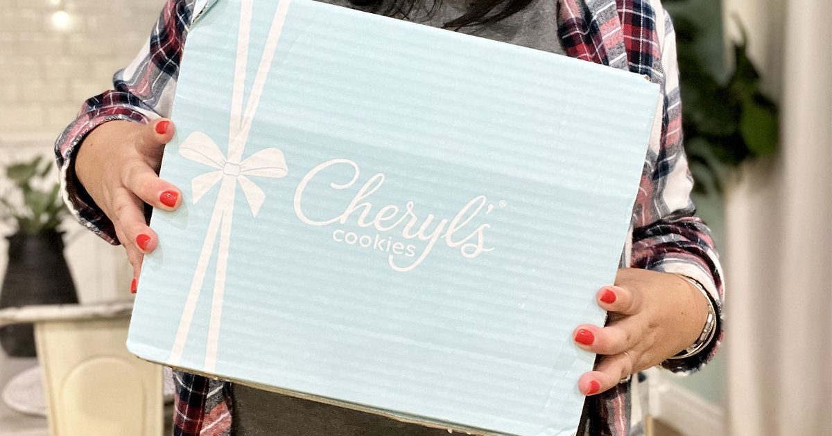 woman holding cheryls cookies box
