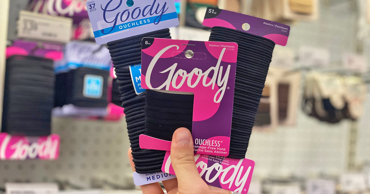 hand holding three packs of goody hair ties