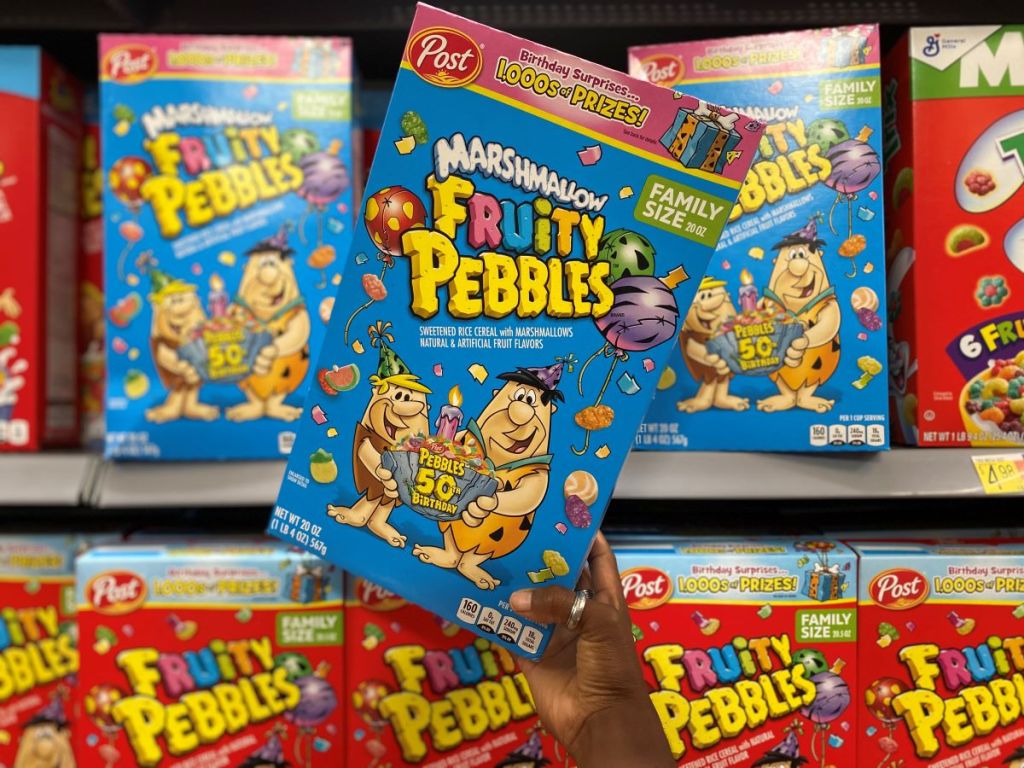 hand holding a box of Marshmallow Fruity Pebbles
