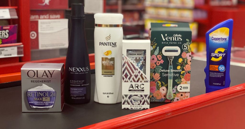 shampoo, sunblock, moisturizer, and razors on conveyor belt