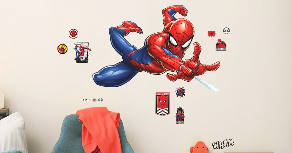 large spiderman decal on bedroom wall