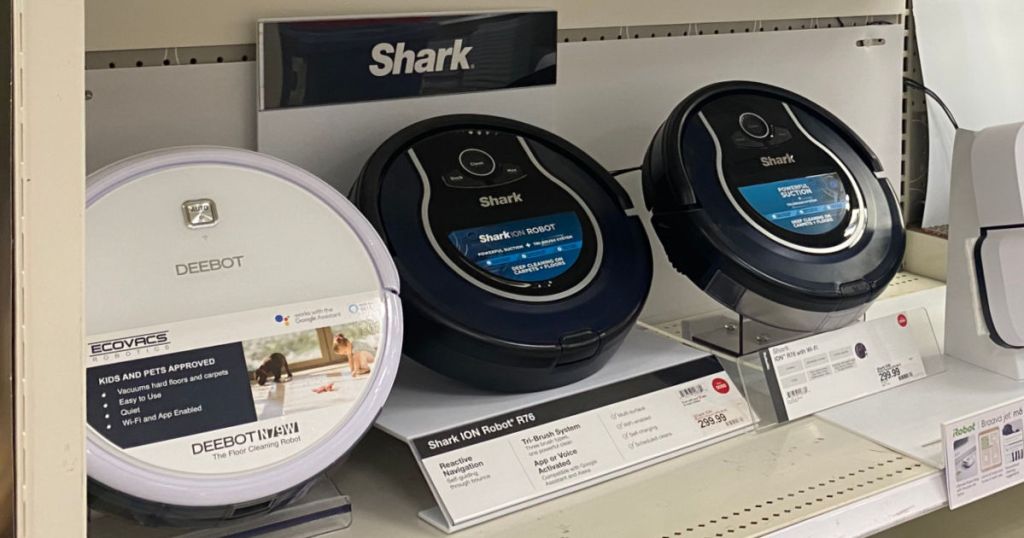 3 robot vacuums on display at store for black friday