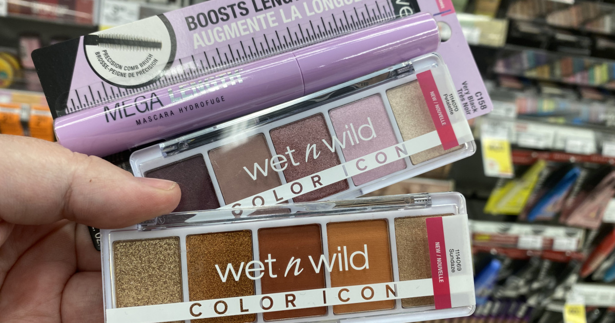 hand holding Wet n wild cosmetics