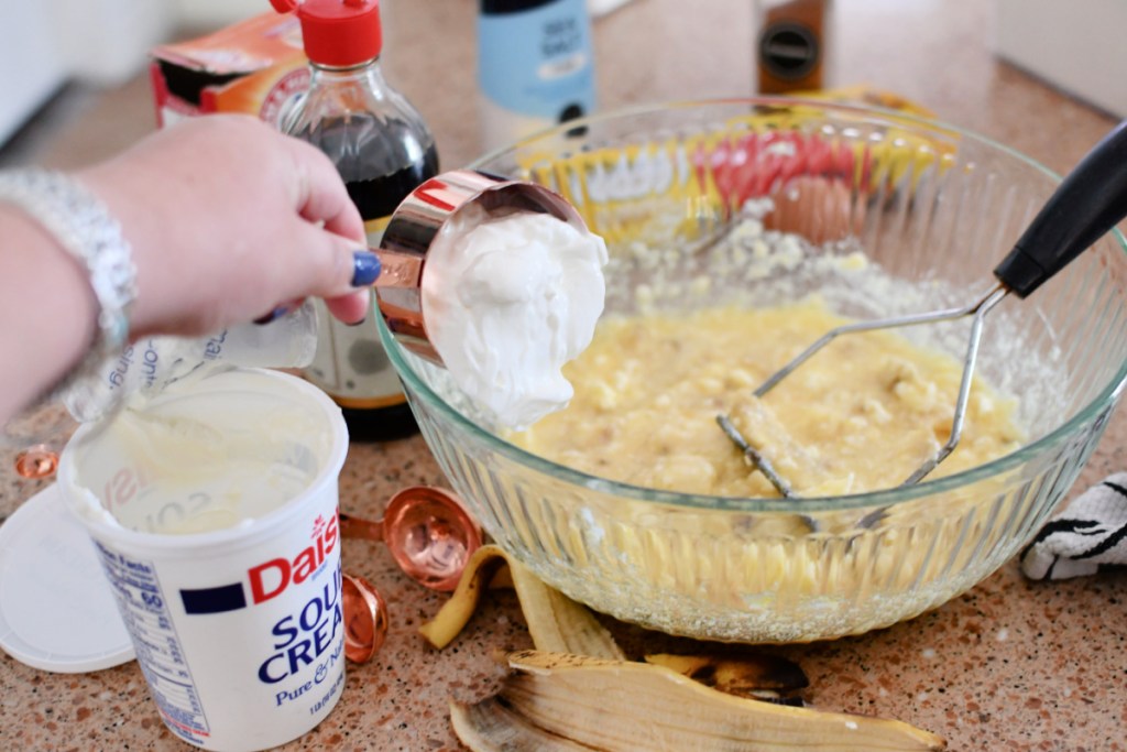 adding sour cream to banana bread