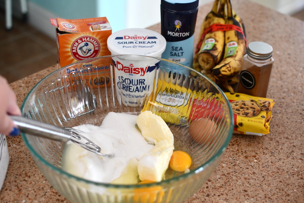 mixing butter and sugar in bowl to make banana bread