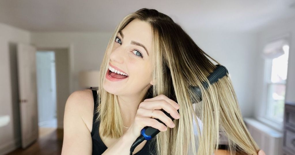 woman using straightener