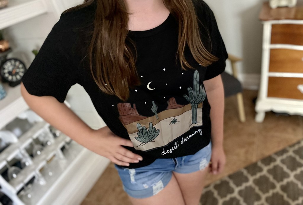 girl wearing cute t-shirt from shein using shein coupon code