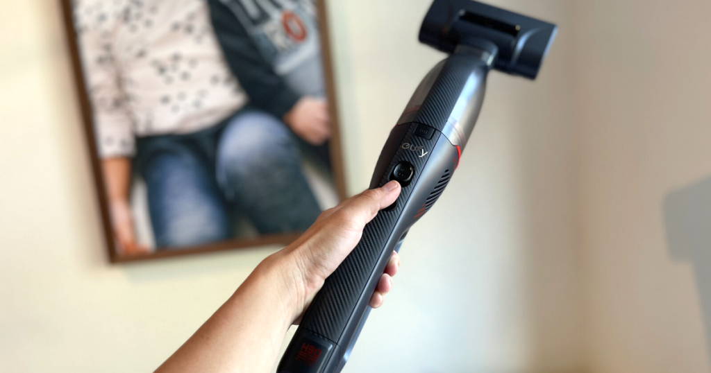 holding eufy handheld vacuum 