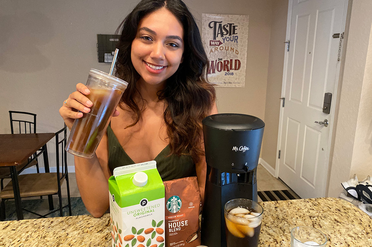 woman holding iced coffee with mr coffee iced coffee maker