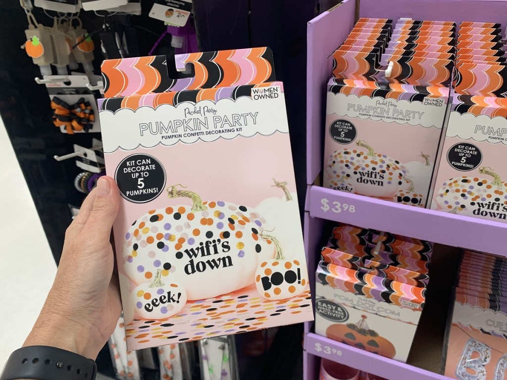 holding a pumpkin decorating kit