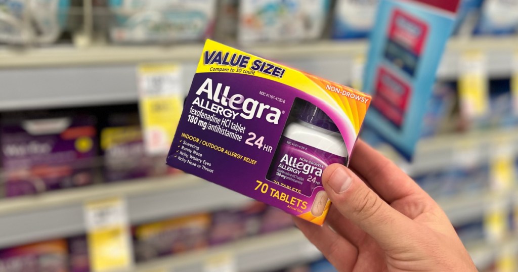 hand holding purple box of allergy medicine 