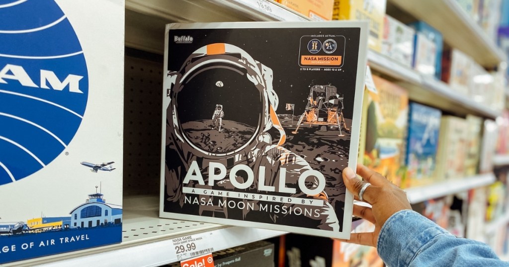 hand holding apollo moon mission NASA inspired game