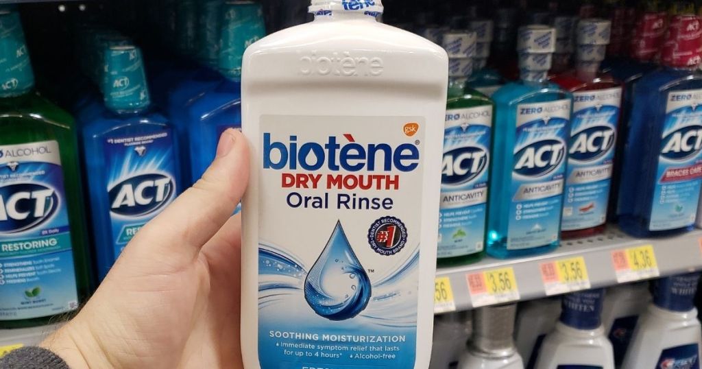 hand holding a bottle of Biotene