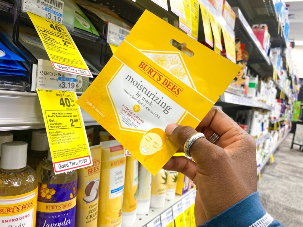 hand holding burt's bees lip mask in store