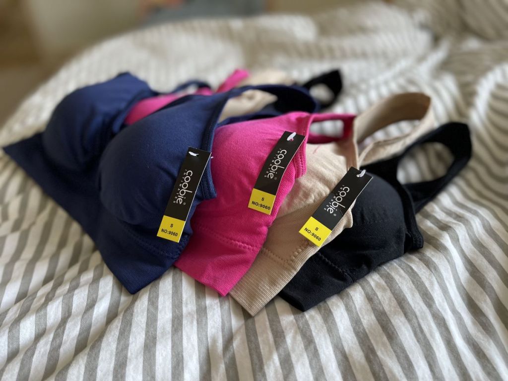 bras laying on a bed