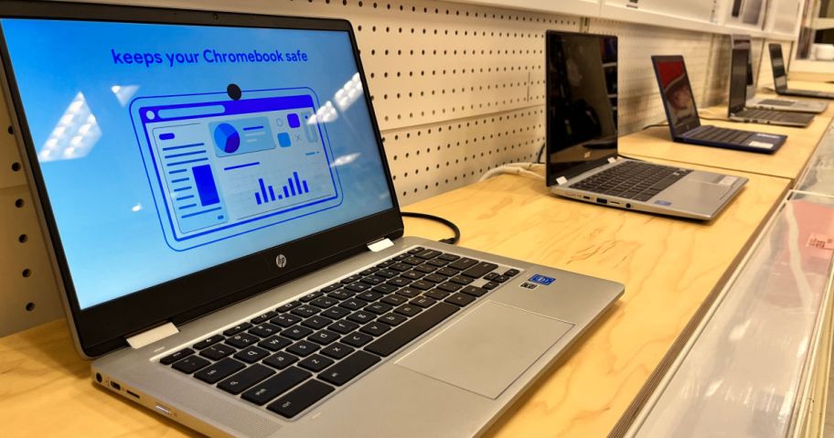 silver laptops on shelf