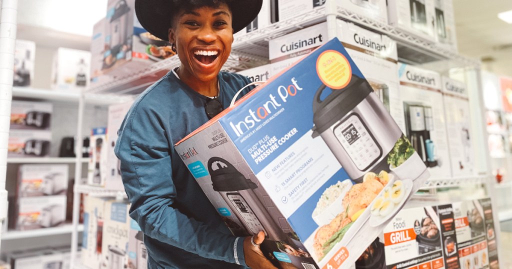 person holding Instant Pot in store