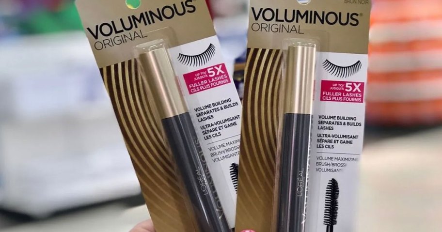 Holding two Loreal Voluminous Mascaras