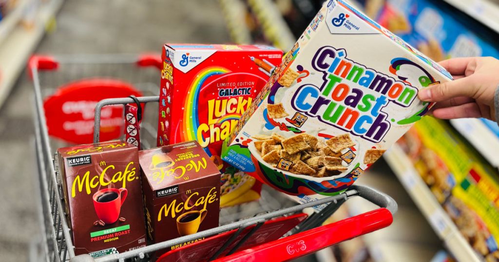 hand grabbing box of cereal from cart 