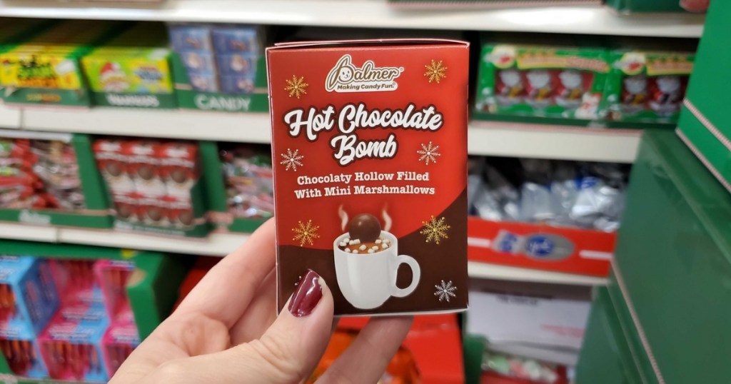hand holding hot chocolate bomb in store