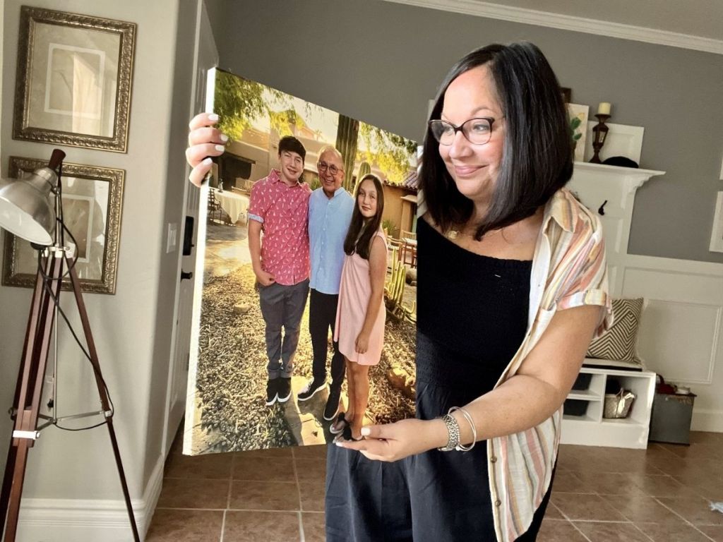 woman holding canvas photo 