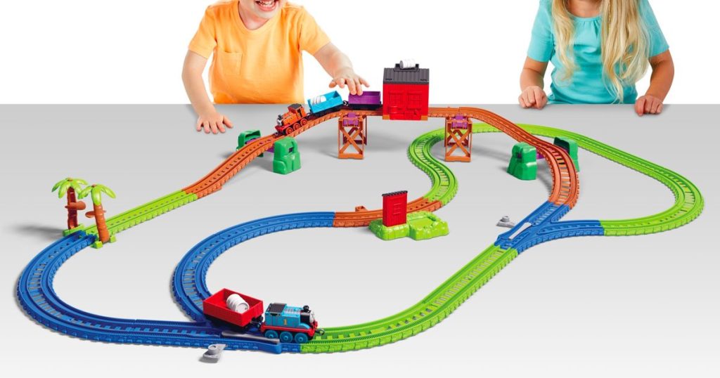 Two kids playing with the Thomas & Friends Trackmaster Thomas & Nia Cargo Delivery Set