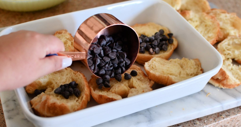 adding chocolate chips to bread pudding