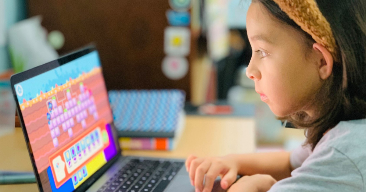 girl looking at a computer