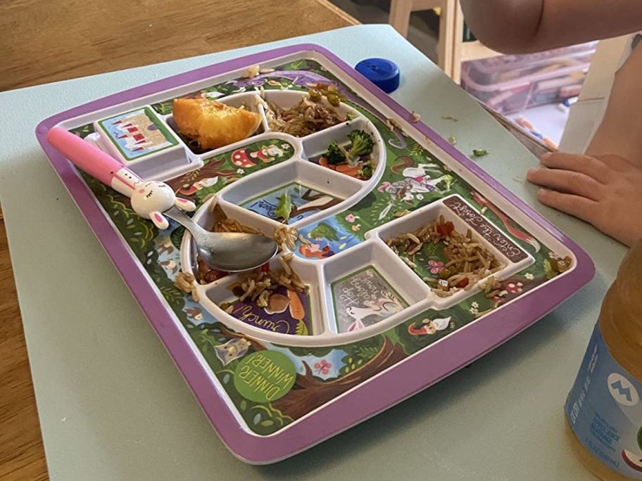 kid eating from Dinner Winner Enchanted Forest Tray