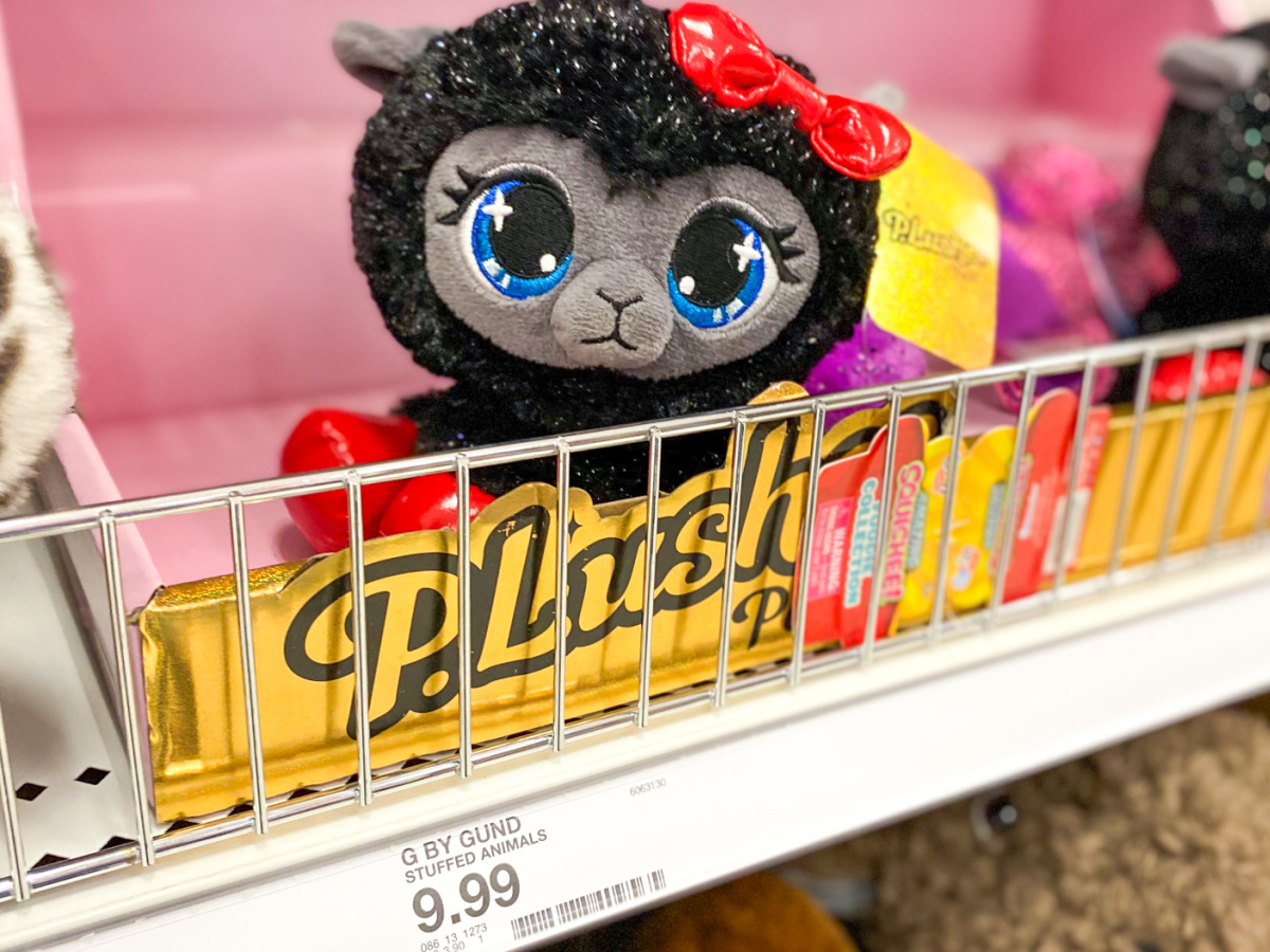 store shelf with stuffed kitty with big eyes