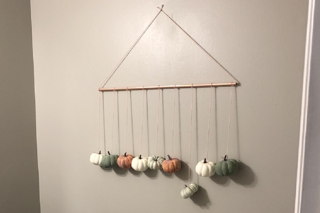 pumpkin wall hanging in bathroom