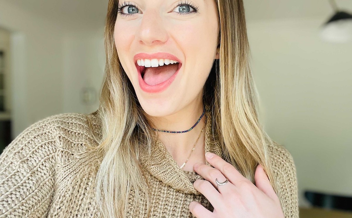 woman showing off necklace 