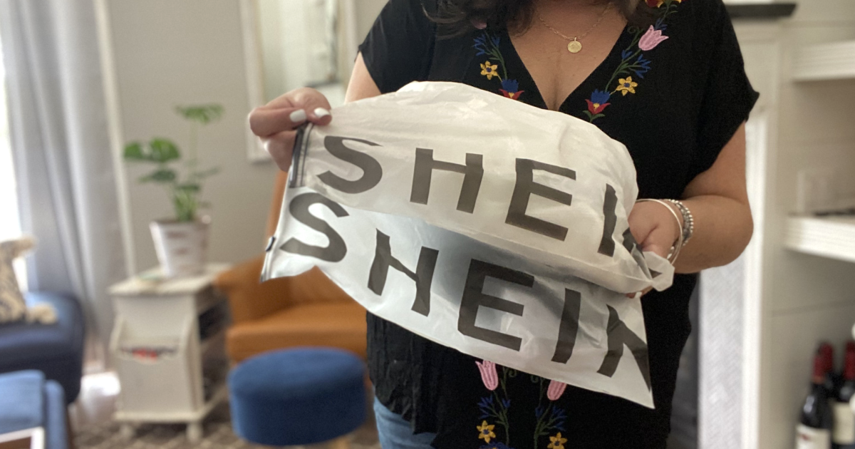woman holding Shein bags in living room 