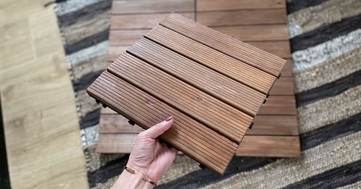 hand holding wood tile