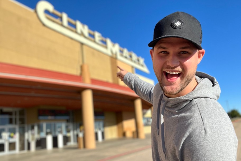 man standing outside of Cinemark