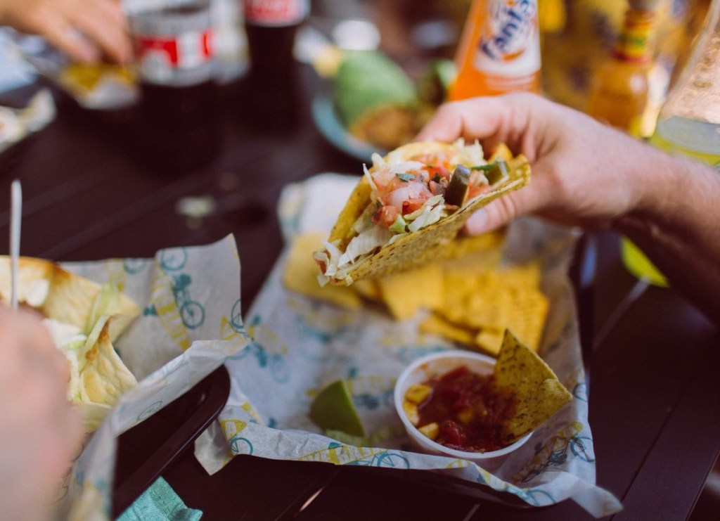 holding a taco for national taxo day